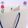 Saco de papel branco de estilo luxuoso de estilo reciclável, logotipo personalizado Logotipo impresso Bolsa de papel branco